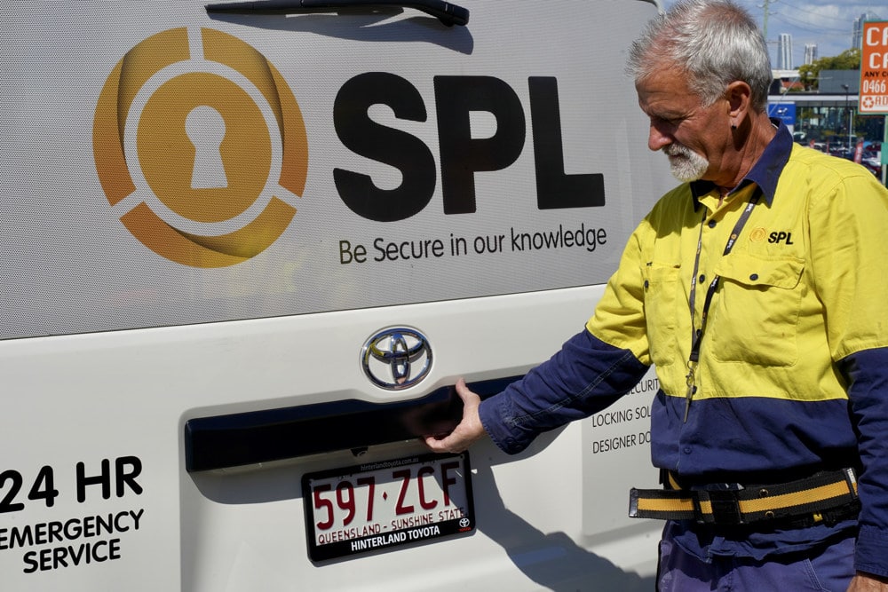 Man Opening The Back Door Of Vehicle — SPL Security in Balina NSW